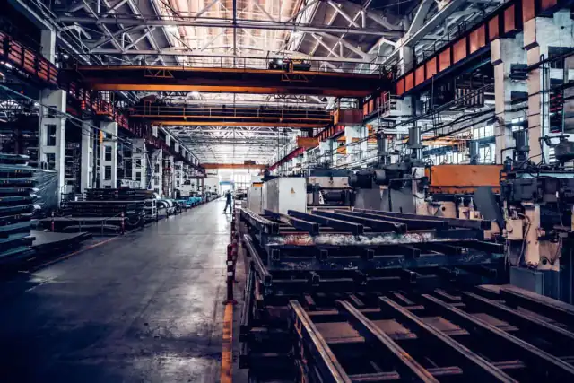 Large industrial factory hall with heavy equipment