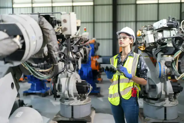 Engineer inspecting industrial plant machinery